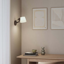 Load image into Gallery viewer, Imari Adjustable Wall Light in living room.