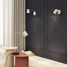 Load image into Gallery viewer, Miura LED Swing Arm Wall Light in living room.