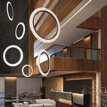 Load image into Gallery viewer, Roda LED Vertical Pendant Light in living room.