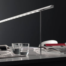 Load image into Gallery viewer, Lineal Biblo LED Table Lamp in living room.