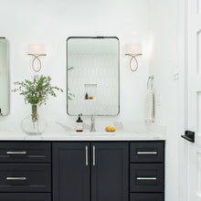 Load image into Gallery viewer, Brinkley Wall Light in bathroom.