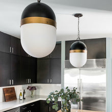 Load image into Gallery viewer, Capsule Outdoor Pendant Light in kitchen.