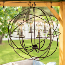 Load image into Gallery viewer, Solaris Outdoor Chandelier in Outside Area.