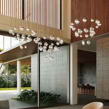 Load image into Gallery viewer, Grapes® 24-Light Round LED Multipoint Pendant Light in living room.