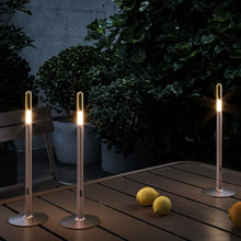 Load image into Gallery viewer, Glim Outdoor LED Portable Table Lamp in Outside Area.