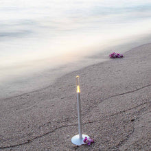 Load image into Gallery viewer, Glim Outdoor LED Portable Table Lamp in Outside Area.
