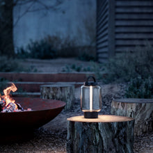 Load image into Gallery viewer, Qu Outdoor LED Portable Table Lamp in Outside Area.