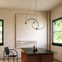 Load image into Gallery viewer, Isho LED Chandelier in living room.