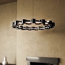 Load image into Gallery viewer, Nami LED Chandelier in living room.