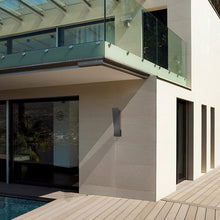 Load image into Gallery viewer, Nevis Outdoor LED Wall Light in Outside Area.