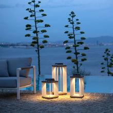 Load image into Gallery viewer, Blade Outdoor Solar LED Lantern in Outside Area.