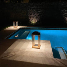 Load image into Gallery viewer, Blade Outdoor Solar LED Lantern in Outside Area.