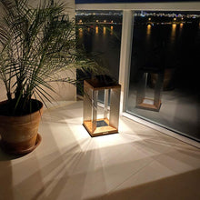 Load image into Gallery viewer, Blade Outdoor Solar LED Lantern in Outside Area.
