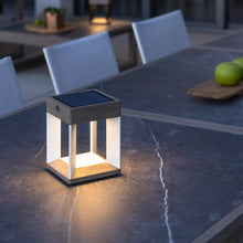 Load image into Gallery viewer, Blade Outdoor Solar LED Table Lamp in Outside Area.