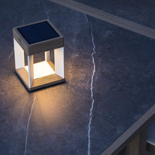 Load image into Gallery viewer, Blade Outdoor Solar LED Table Lamp in Outside Area.