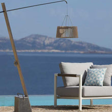 Load image into Gallery viewer, Pendulum Outdoor Solar LED Floor Lamp in Outside Area.