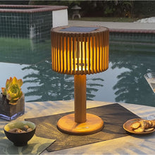 Load image into Gallery viewer, Pixy Outdoor Solar LED Table Lamp in Outside Area.