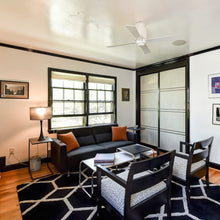 Load image into Gallery viewer, Lapa Flush Mount Ceiling Fan in living room.