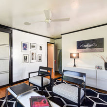Load image into Gallery viewer, Lapa Flush Mount Ceiling Fan in living room.