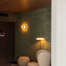 Load image into Gallery viewer, Blossi LED Wall Light in hallway.