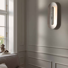 Load image into Gallery viewer, Sasi LED Wall Light in living room.