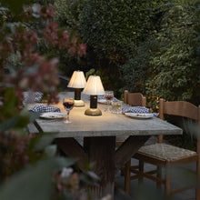 Load image into Gallery viewer, Blossom Outdoor LED Portable Table Lamp in Outside Area.