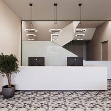 Load image into Gallery viewer, Arctic Rings™ Triple Ring LED Pendant Light in office.