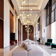 Load image into Gallery viewer, Grapes® 24-Light Round LED Multipoint Pendant Light in living room.