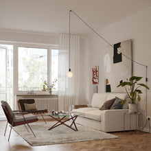 Load image into Gallery viewer, Cylindrical Plug-In Pendant Light in living room.