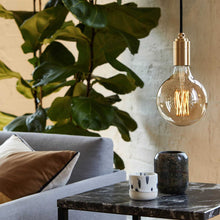 Load image into Gallery viewer, Gaia Medium Base G40 Type LED Bulb in living room.