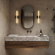 Load image into Gallery viewer, Kilter Wall Light in bathroom.