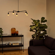 Load image into Gallery viewer, Sphere I G16 Type LED Bulb in living room.