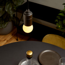 Load image into Gallery viewer, Sphere I G16 Type LED Bulb in living room.