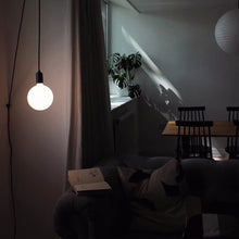 Load image into Gallery viewer, Sphere IV Plug-In Pendant Light in living room.