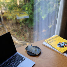 Load image into Gallery viewer, The Muse Wireless Charger in living room.