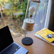 Load image into Gallery viewer, The Muse Wireless Charger in living room.