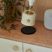 Load image into Gallery viewer, The Muse Wireless Charger in living room.