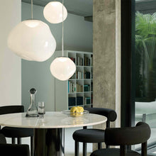 Load image into Gallery viewer, Melt Trio Round LED Pendant Light in living room.