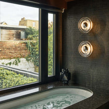Load image into Gallery viewer, Press LED Mini Wall Light in bathroom.
