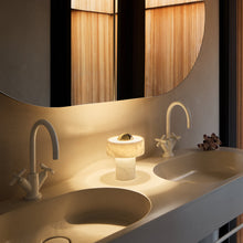 Load image into Gallery viewer, Stone LED Portable Table Lamp in bathroom.