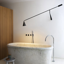 Load image into Gallery viewer, Gordon Adjustable Wall Light in bathroom.