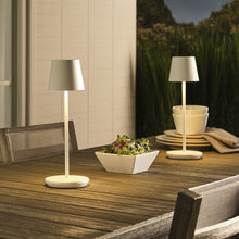 Load image into Gallery viewer, Nevis LED Table Lamp in Outside Area.
