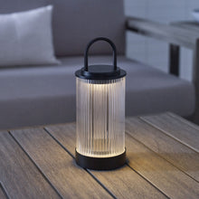 Load image into Gallery viewer, Tawa LED Table Lamp in Outside Area.