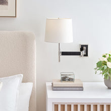 Load image into Gallery viewer, Elle LED Swing Arm Wall Light in bedroom.
