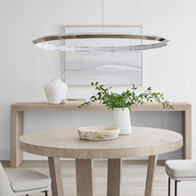 Load image into Gallery viewer, Encircle LED Chandelier in living room.