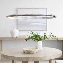 Load image into Gallery viewer, Encircle LED Chandelier in living room.