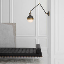 Load image into Gallery viewer, Hicks Adjustable Wall Light in living room.