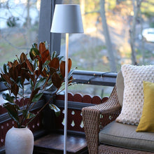 Load image into Gallery viewer, Poldina Pro XXL LED Floor Lamp in living room.