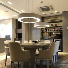 Load image into Gallery viewer, Cylindrical LED Pendant Light in dining room.