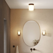 Load image into Gallery viewer, Aquina Bath Wall Light in bathroom.